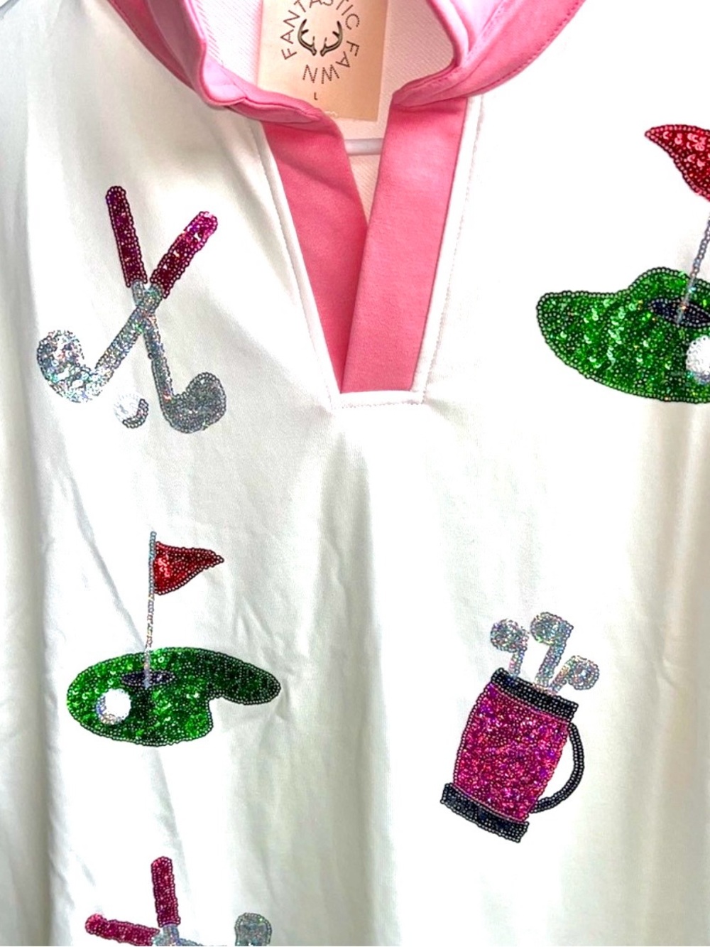 Definitely a hole in one with this cute Sequin golf shirt pink white green